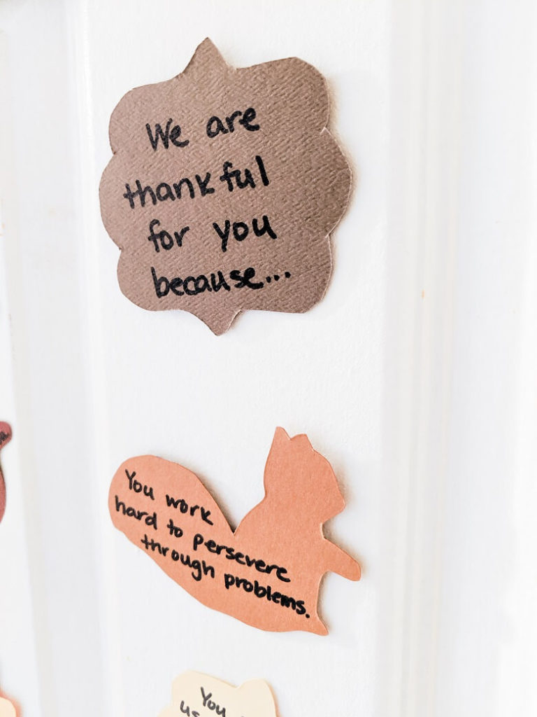 Two thank you notes for kids that are fall cut outs on a door. One is brown and reads "We are thankful for you because..." and the other is orange and reads "You work hard to persevere through problems."