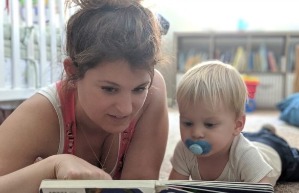 Mother reading to her toddler son