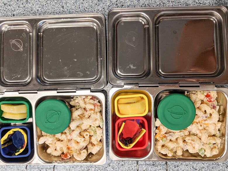 Vegan lunch ideas for school of pasta salad, fruit wrap and kiwi