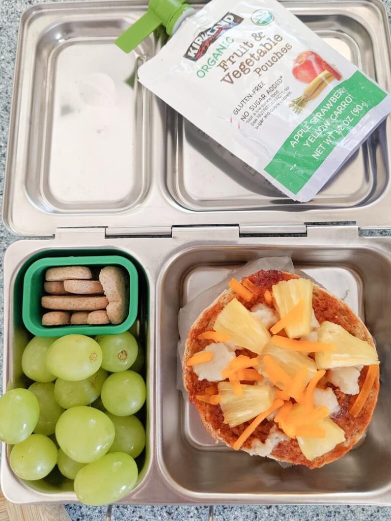 Quick vegan lunch for school of grapes, grahams, fruit pouch and vegan pizza