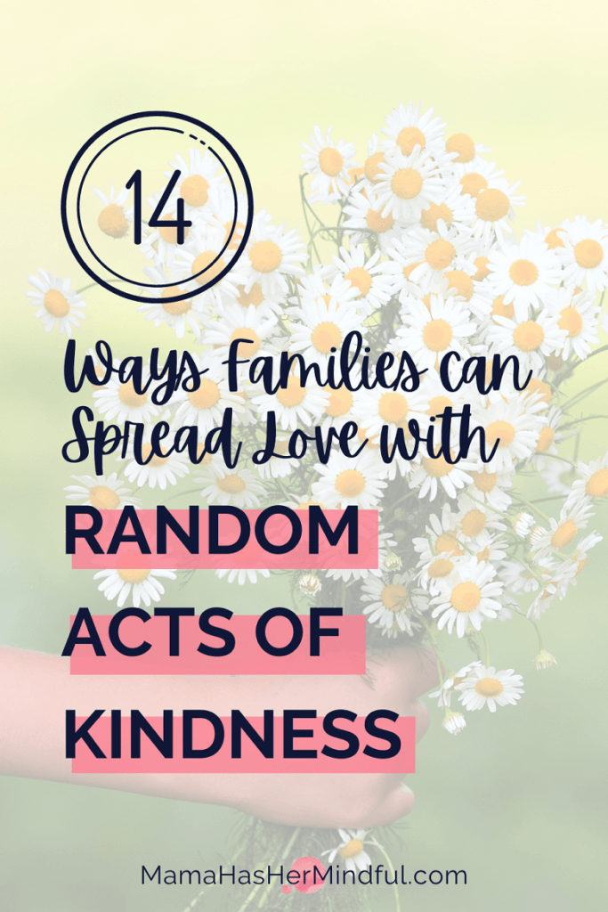 A child's hand holding a bunch of wildflowers with text that reads: 14 Ways Families Can Spread Love with Random Acts of Kindness. The URL is also on the image and reads: Mama Has Her Mindful dot com.