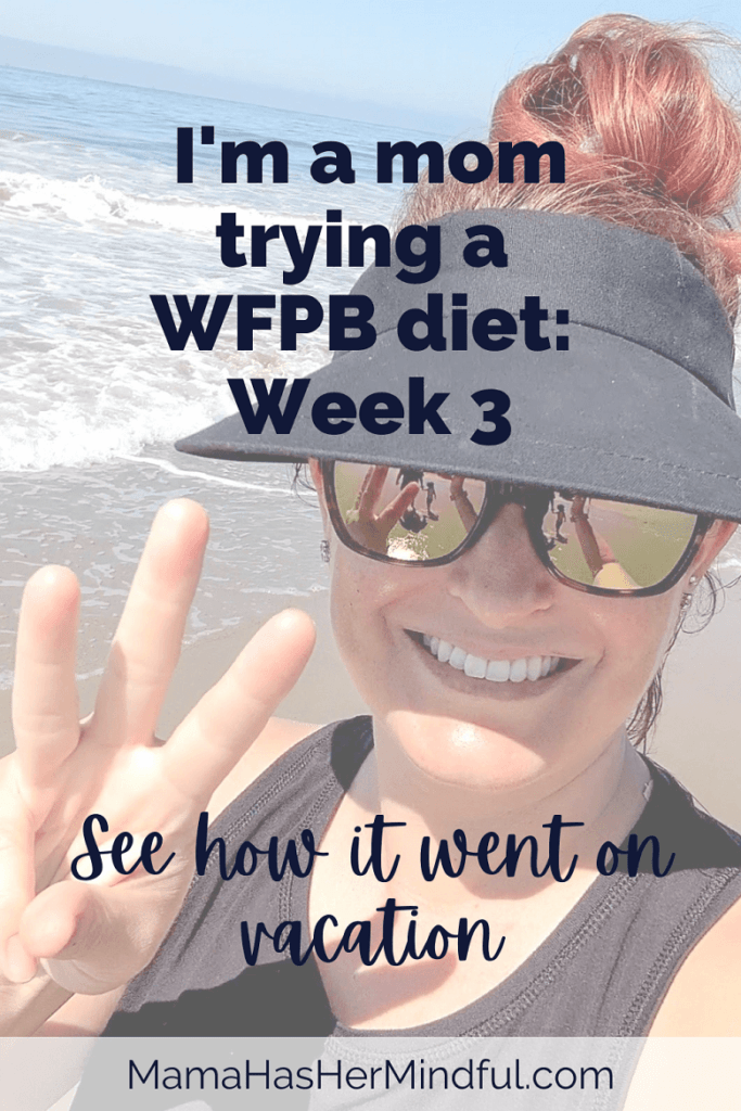 A woman on the beach wearing a tank top and a visor and sunglasses. Her hair is up in a messy bun and she's holding up the number three in her right hand while smiling at the camera. The font over the image reads: I'm a mom trying a WFPB diet: Week 3; See how it went on vacation. The URL is listed Mama Has Her Mindful dot Com.